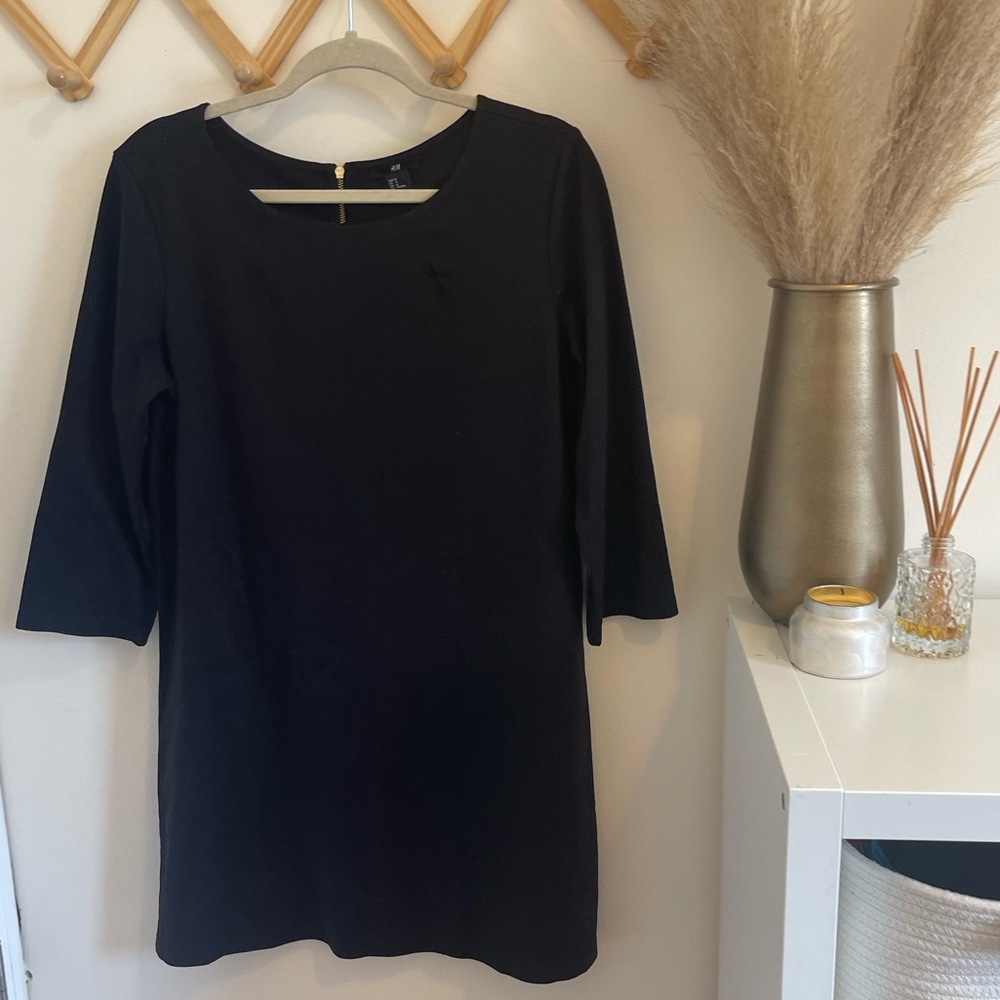 H&M, size medium boat neck black shift dress.
